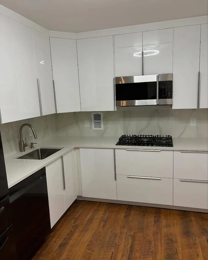 Restored kitchen with white cabinets after water damage in Alondra Park